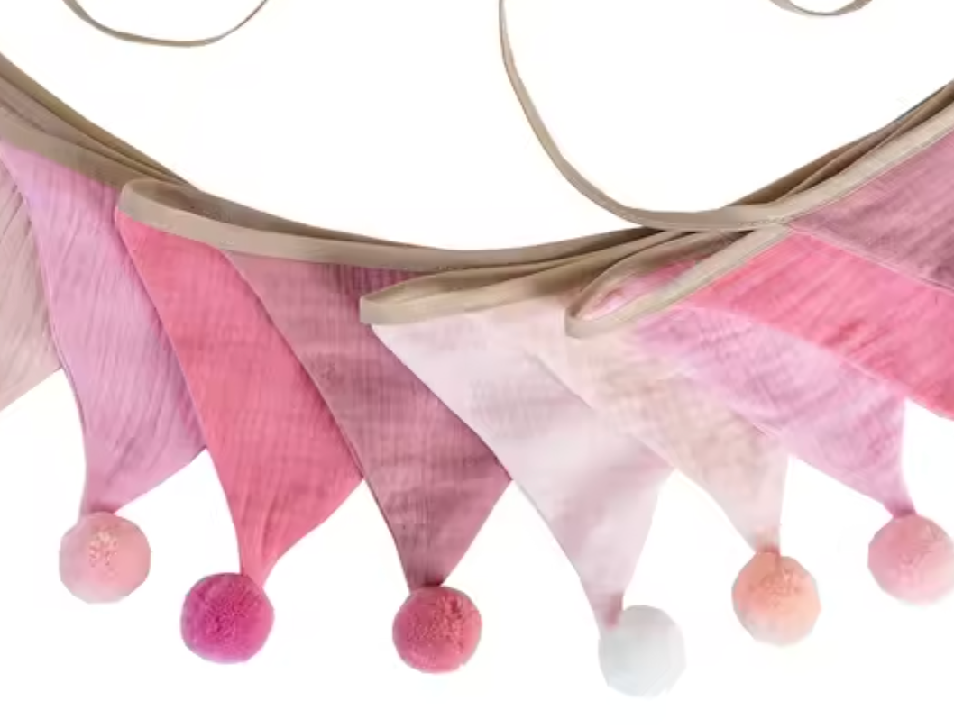 Pink and white fabric banner with pom-pom details on a white background